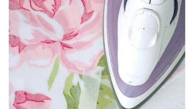 Step 1. Iron interfacing onto the wrong side of the fabric. Francois Oberholster / Gallo Images