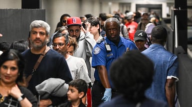 Travellers wait in long security lines at George Bush Intercontinental Airport in Houston, Texas. AFP