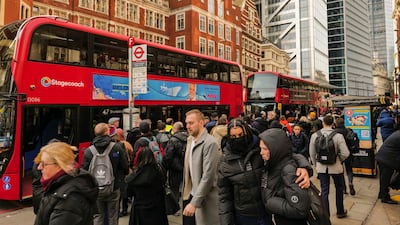 Commuters try to board buses outside Liverpool Street railway station during a strike by London Underground workers. Bloomberg
