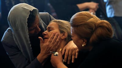 A mother of one of the victims attends a funeral at Prince Tadros Church. Reuters