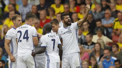 Diego Costa, right, celebrates with teammates after scoring the winning goal. Frank Augstein / AP Photo