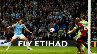 Martin Demichelis of Manchester City scores their third goal past goalkeeper Ben Foster of West Bromwich Albion on Monday. Alex Livesey / Getty Images / April 21, 2014