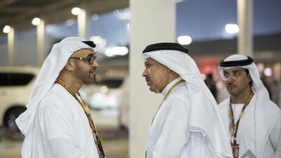 Sheikh Mohammed bin Zayed, Crown Prince of Abu Dhabi and Deputy Supreme Commander of the Armed Forces, left, bids farewell to Dr Abdullatif Al Zayani, Secretary General of the Gulf Cooperation Council for the Arab States of the Gulf, right, after the final race of the 2014 Formula 1 Etihad Airways Abu Dhabi Grand Prix, at Yas Marina Circuit. Seen with Sheikh Hazza bin Zayed, National Security Advisor and Vice Chairman of the Abu Dhabi Executive Council, back right. Ryan Carter / Crown Prince Court — Abu Dhabi