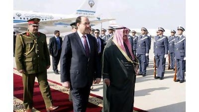 Nouri al Maliki, centre, welcomes his Kuwaiti counterpart Sheikh Nasser Mohammed al Sabah to Baghdad.