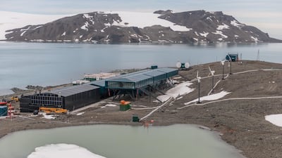The North Lake supplies water to Comandante Ferraz Station, with a view of the solar power wall, wind power plant and internet module in King George Island, Antarctica. Getty Images