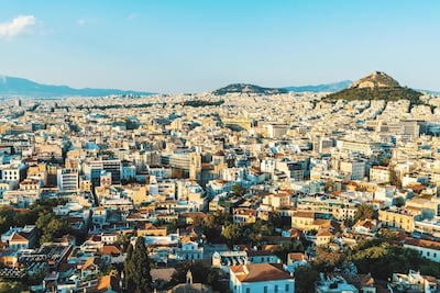 Fly from Dubai to Athens then onwards to London. Unsplash