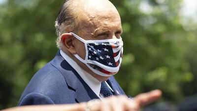 Rudy Giuliani, personal lawyer to US President Donald Trump, wears a protective mask following a television interview outside the White House in Washington DC, USA. Bloomberg