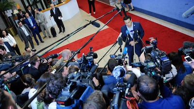 Greek prime minister Alexis Tsipras talks to the press at the end of the Eurozone leader summit on the Greek crisis, at the European Council headquarters in Brussels, Belgium on July 13, 2015. Eurozone leaders have unanimously agreed to a new bailout programme for Greece, EU President Donald Tusk says. Laurent Dubrule/EPA