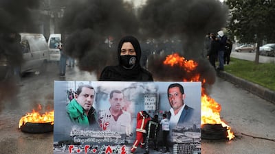 A relative of one of the victims of the Beirut port explosion takes part in a protest outside the Justice Palace in Beirut, Lebanon on February 19, 2021 after the supreme court removed the judge leading the investigation into the blast. Reuters