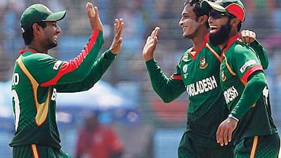 Shakib al Hasan, the Bangladesh captain, celebrates with teammates after running out Eric Szwarczynski during Netherland's innings of 160 in Chittagong.