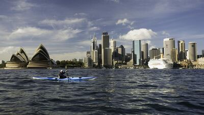 Kayaking past the Sydney Opera House. Getty Images