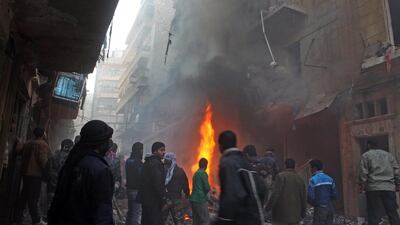 A building catches fire after an airstrike on a rebel-held area of Aleppo, where air attacks have become commonplace. Mohammed Al Khatieb / AFP