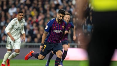 Barcelona's Luis Suarez scores from the penalty spot to make it 3-0. EPA