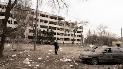 Associated Press photographer Evgeniy Maloletka stands amid rubble of an airstrike on Pryazovskyi State Technical University in Mariupol, Ukraine. AP