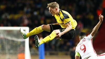 Borussia Dortmund's Matthias Ginter, left, in action against Monaco's Radamel Falcao, right. Sebastien Nogier / EPA