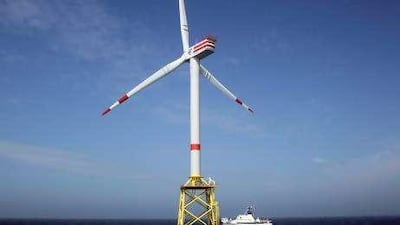 A ship passes the first German windmill offshore power plant in the North Sea.