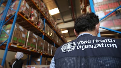 Employees from International Humanitarian City and the World Humanitarian Organisation gather while uploading aid and relief goods for the victims of the Afghanistan earthquake, in Dubai in June 2022. EPA