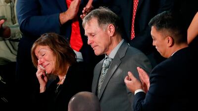 Parents of Otto Warmbier, the American student who died days after being freed from imprisonment in North Korea, react to a standing ovation during President Donald Trump's State of the Union address to a joint session of Congress on January 30, 2018. Pablo Martinez Monsivais / AP Photo