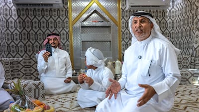 Mubarak Musallam Al Mansoori hosts fellow Emiratis in his solar-powered majlis on wheels, while he watches his camels graze through the window