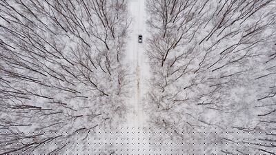 A car driving through a snow-covered landscape near Debrecen, Hungary. EPA