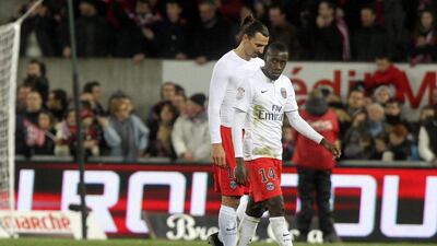 Zlatan Ibrahimovic and Blaise Matuidi of PSG walk off the pitch after their defeat to Guingamp in Ligue 1 on Sunday night. Eddy LeMaistre / EPA / December 14, 2014
