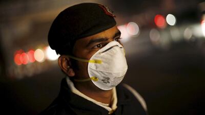 A traffic policeman wears a mask to protect himself from dust and air pollution in New Delhi, India. Adnan Abidi / Reuters