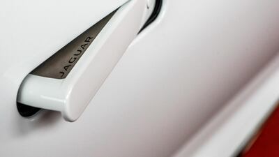 Pop-out door handles are among stylistic similarities with the Aston Martin DB11. Victor Besa / The National