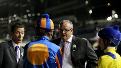Mike de Kock speaks to jockeys during the first Longines Carnival Meeting at the Meydan Racecourse on January 9, 2014 in Dubai, UAE. Francois Nel / Getty Images
