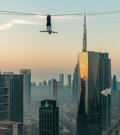 World champion slackliner Jaan Roose walking across the distance between the Jumeirah Emirates Towers. Photo: UAE Government Media Office