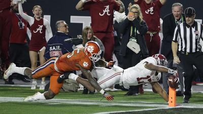Alabama's Kenyan Drake gets past Clemson's T.J. Green as he runs back a kick off for a touchdown during the second half of the NCAA college football playoff championship game Monday, Jan. 11, 2016, in Glendale, Ariz. (AP Photo/David J. Phillip)