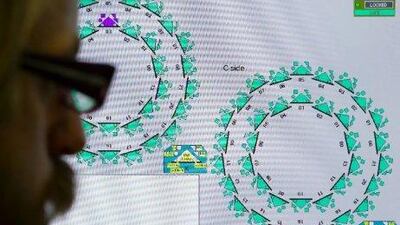 A monitor tracks high-energy collisions between two microscopic beams of particles in the Large Hadron Collider near Geneva. A team from the centre that houses the collider has detected particles travelling faster than the speed of light - a finding that appears certain to be proved wrong within a year. Fabrice Coffrini / AFP