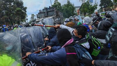 Colombia's Misak people clash with riot police in Bogota during a protest against the government. AFP