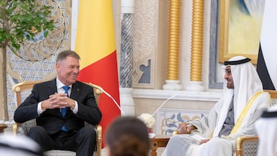 The President and Mr Iohannis share a light-hearted moment during talks at Qasr Al Watan. Mohamed Al Hammadi / UAE Presidential Court