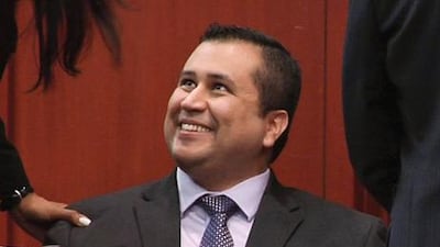 George Zimmerman smiles after a not guilty verdict was handed down in his trial at the Seminole County Courthouse. AP Photo / TV Pool