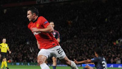 Manchester United striker Robin van Persie celebrates scoring the second goal of the match during Wednesday's Champions League win over Olympiakos. Peter Powell / EPA / March 19, 2014
