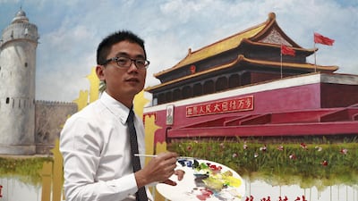 Chinese artist and teacher, Jack Lee stands in front of his collaborative painting with Emirati Artist, Mohammed Mandi of the Tiananmen Square entrance and the Qasr Al hosn Fort. Victor Besa / The National