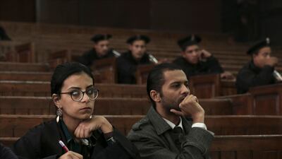 Mahienour El Masry, left, a prominent activist and rights lawyer, takes notes during a 2014 trial in Cairo. AP