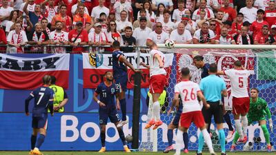 Adam Buksa of Poland scores the opening goal. EPA