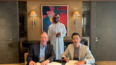 Sheikh Tahnoun bin Zayed, Deputy Ruler of Abu Dhabi and chairman of G42, witnesses the signing ceremony between Peng Xiao, group chief executive of G42, right, and Brad Smith, vice chairman and president of Microsoft. Photo: G42
