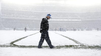 Detroit head coach Jim Schwartz stalks the snowy sidelines in Philadelphia. Matt Rourke / AP