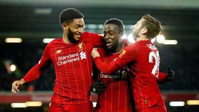 Liverpool's Divock Origi, centre, celebrates scoring their fifth goal. Reuters