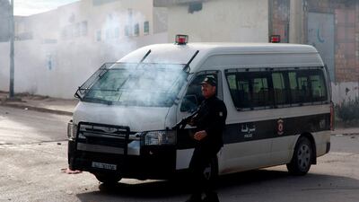 Policemen fire teargas towards protesters during a demonstration. AFP
