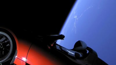 This image from video provided by SpaceX shows the company's spacesuit in Elon Musk's red Tesla sports car which was launched into space during the first test flight of the Falcon Heavy rocket. SpaceX via AP