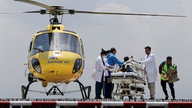 Medical staff receive Dawa Sherpa, who was missing for six days on Mount Everest, on the helipad at HAMS Hospital in Kathmandu, Nepal. Reuters