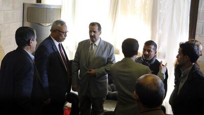 Kuwaiti ambassador to Yemen Fahd Almeie (C) talks to a Houthi delegation before departing on a Kuwait-chartered plane to UN-sponsored peace talks in Sweden. EPA