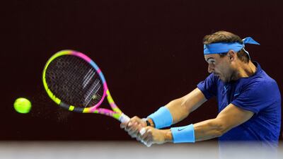 Spain's Rafael Nadal hits a return to Serbia's Novak Djokovic. AFP