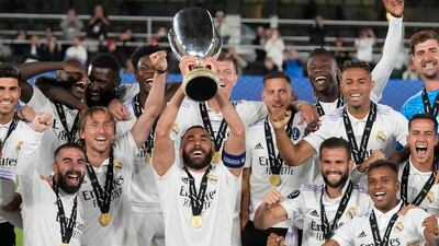 Real Madrid's Karim Benzema lifts the trophy after winning the Uefa Super Cup final. AP Photo