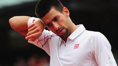 Novak Djokovic feels the pressure against Jo-Wilfried Tsonga.
