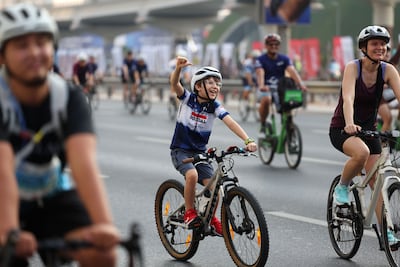 Cyclists of all ages take part in the Dubai Ride on Sheikh Zayed Road on Sunday morning, as part of the Dubai Fitness Challenge 30x30. Chris Whiteoak / The National.