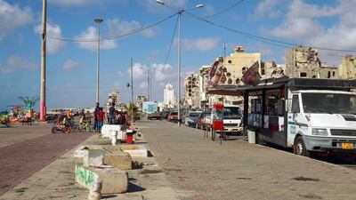 Libyans spend time on the waterfront promenade in the eastern port city of Benghazi. AFP